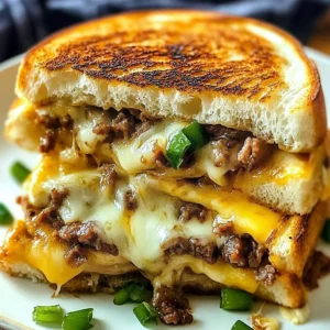 Philly cheesesteak grilled cheese casserole with melted cheese and peppers