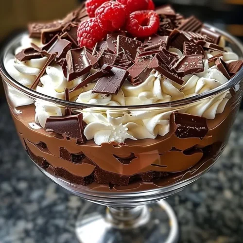 Delicious Baileys chocolate cheesecake trifle layered in a glass dish