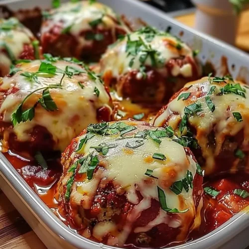 Baked mozzarella stuffed meatballs served on a plate