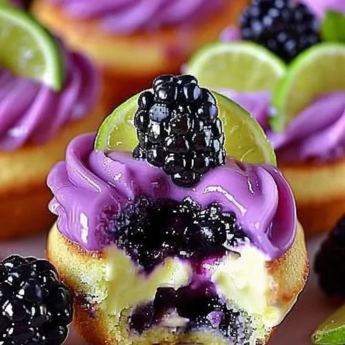 Blackberry Lime Cheesecake Cupcakes topped with fresh berries and lime zest