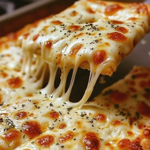 Golden, cheesy breadsticks fresh out of the oven, perfect for dipping.