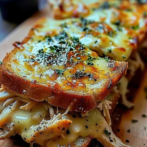 Cheesy Chicken Garlic Bread Sandwich with melted cheese and herbs