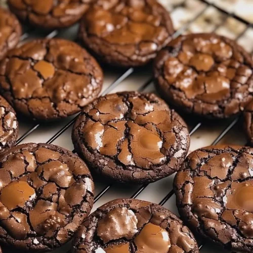 Delicious chewy fudgy chocolate cookies on a cooling rack