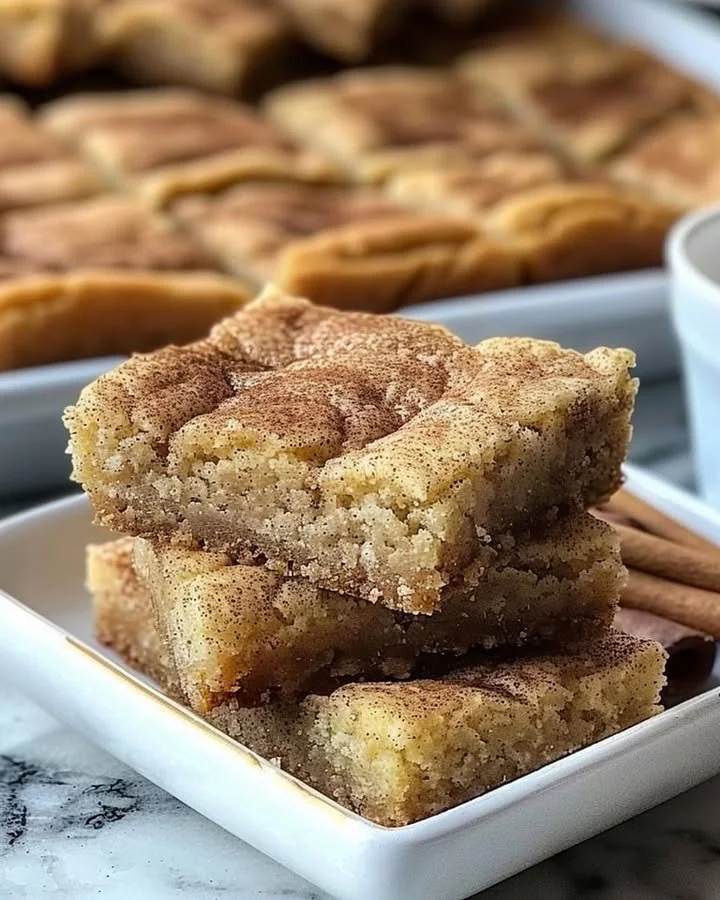 Chewy snickerdoodle cookie bars topped with cinnamon and sugar