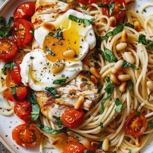 Chicken and Roasted Tomato Pasta served in a bowl with fresh herbs