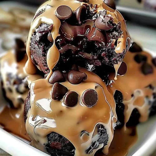 Chocolate chip cookie dough brownie bombs topped with chocolate drizzle
