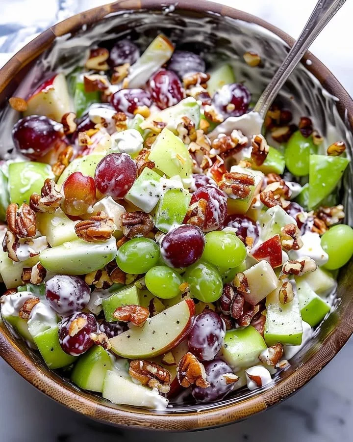Classic Waldorf Salad with apples, celery, and walnuts served in a bowl