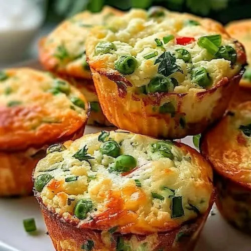Cottage cheese breakfast muffins with fresh toppings on a wooden table