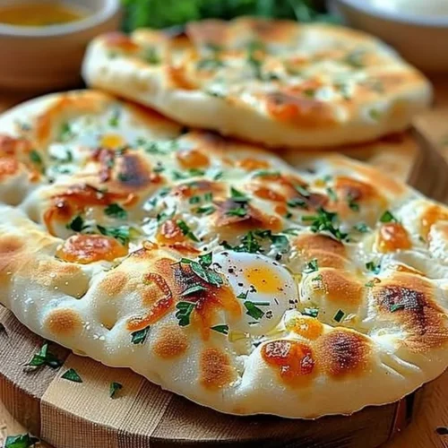 Cottage cheese flatbread served with fresh toppings and herbs.