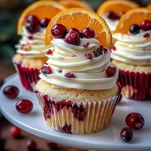 Cranberry Orange Cupcakes topped with white chocolate frosting
