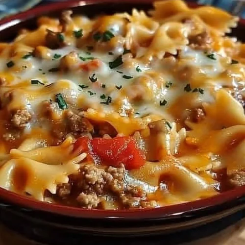 Creamy Velveeta and ground beef bowtie pasta served in a bowl