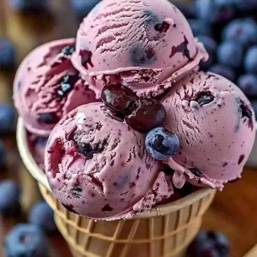 Crimson Choco Rhapsody Ice Cream in a bowl with chocolate drizzle