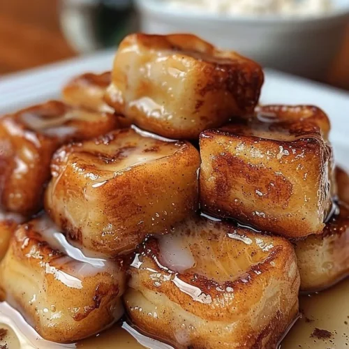 Crispy cinnamon roll French toast bites with sweet maple glaze
