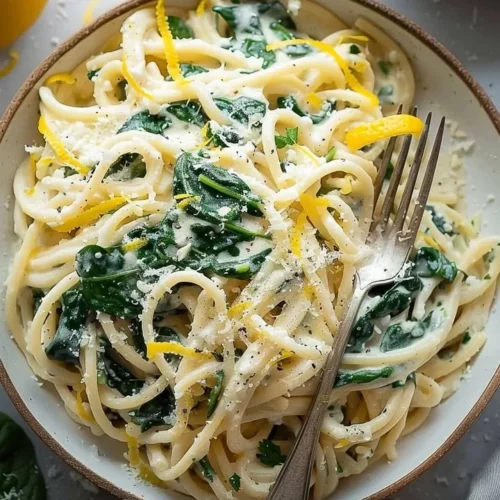 Delicious easy lemon ricotta pasta with fresh spinach served in a bowl.