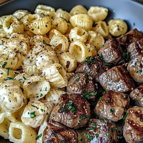 Delicious Garlic Butter Steak Bites served with creamy Parmesan pasta shells.