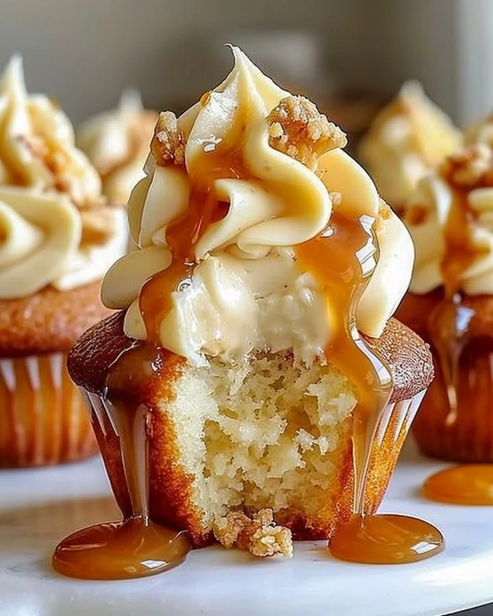 Gooey salted caramel cream cheese cupcakes with rich frosting and caramel drizzle
