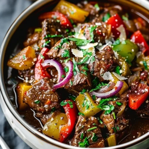 Guinness Braised Beef Stew served in a rustic bowl with fresh herbs
