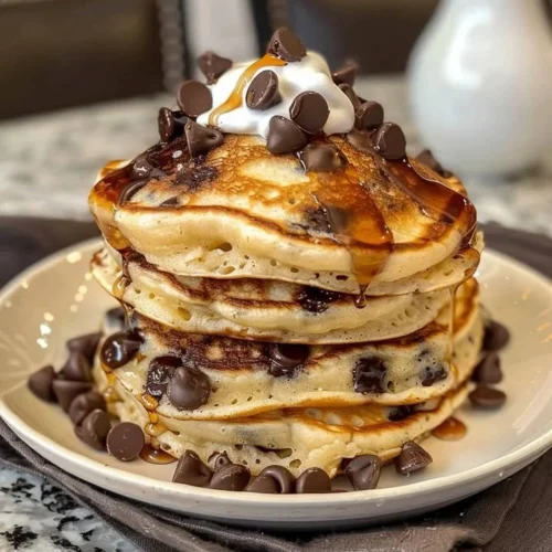 Delicious Heavenly Morsels Chocolate Pancakes served with syrup and berries