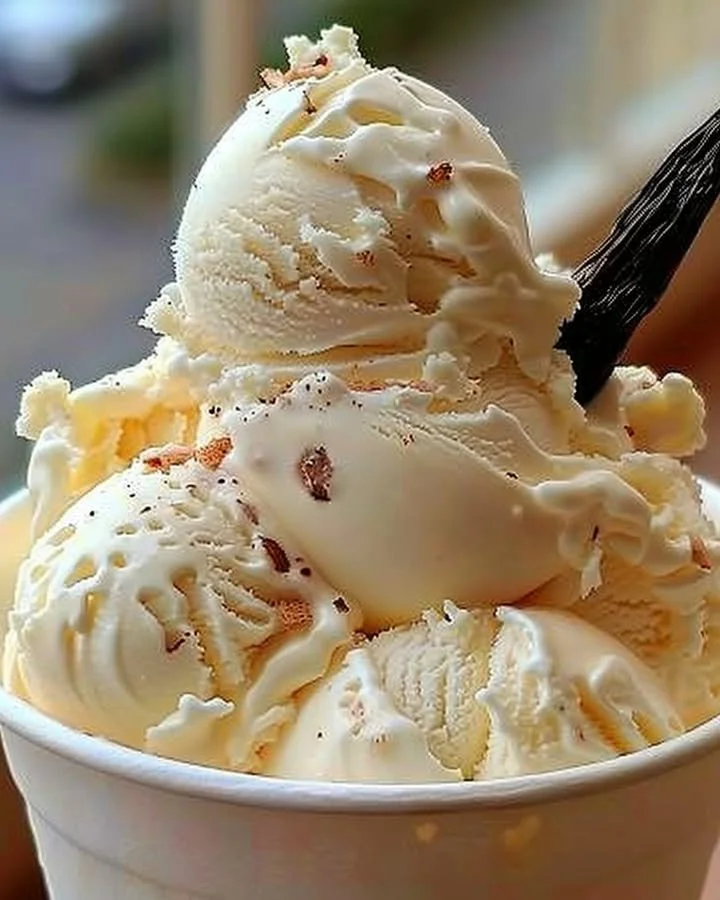 Bowl of homemade vanilla ice cream with fresh vanilla beans