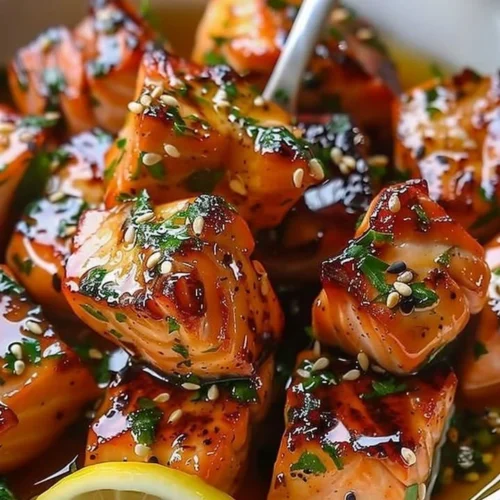 Honey butter garlic glazed salmon bites served on a plate