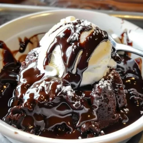 Delicious slice of Hot Fudge Chocolate Pudding Cake topped with chocolate sauce