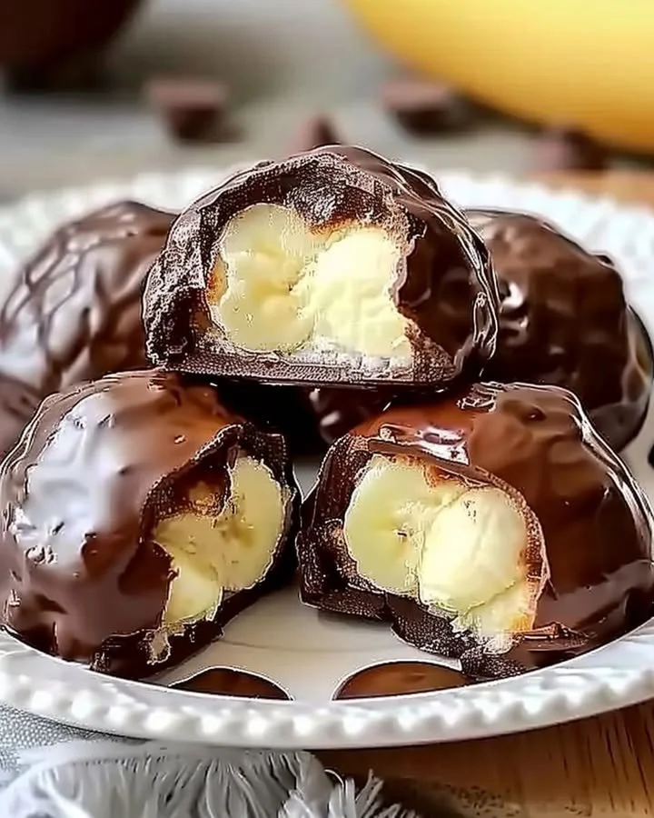 Irresistible banana pudding chocolate puffs dessert with layers of creamy banana and chocolate.