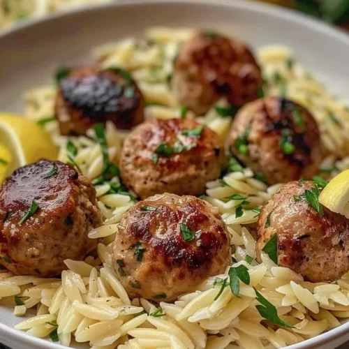 Lemon Chicken Ricotta Meatballs served with garlic orzo in a bowl