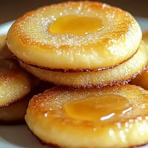 Delicious lemon curd cookies topped with brûlée for a delightful dessert experience.