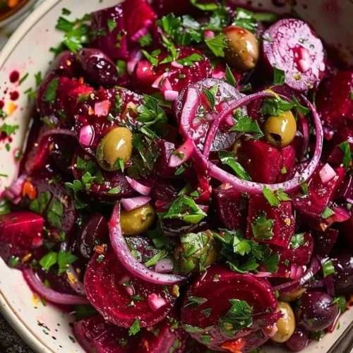Mediterranean Beetroot Olive Citrus Salad in a bowl with colorful ingredients