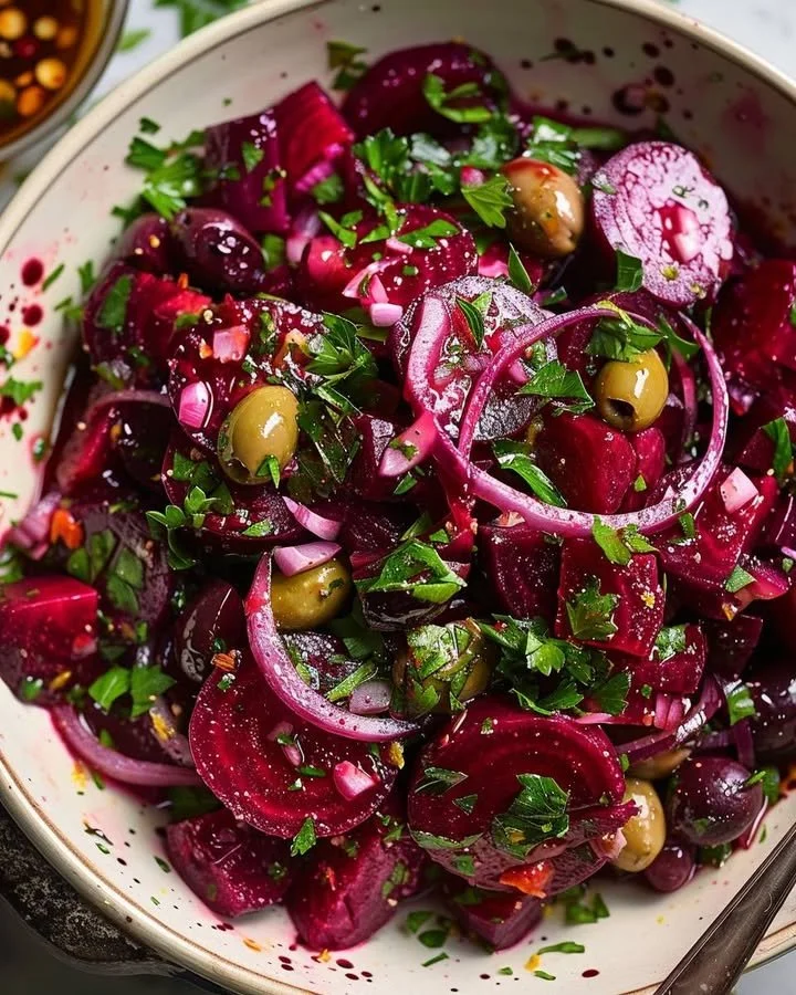 Mediterranean Beetroot Olive Citrus Salad in a bowl with colorful ingredients