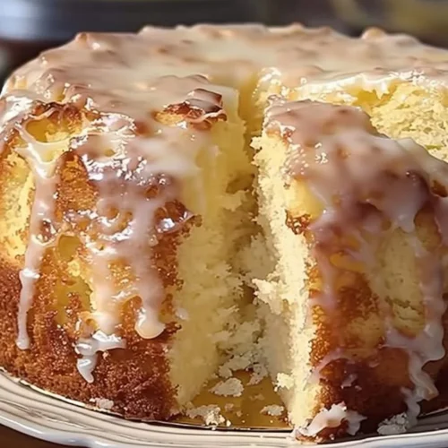 Delicious Pina Colada Pound Cake topped with pineapple and coconut frosting