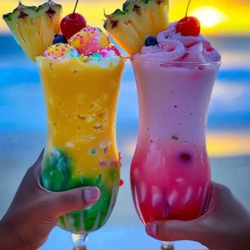 Colorful Rainbow Sherbet Piña Colada served in a tropical glass