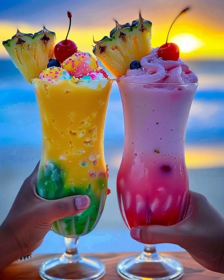 Colorful Rainbow Sherbet Piña Colada served in a tropical glass