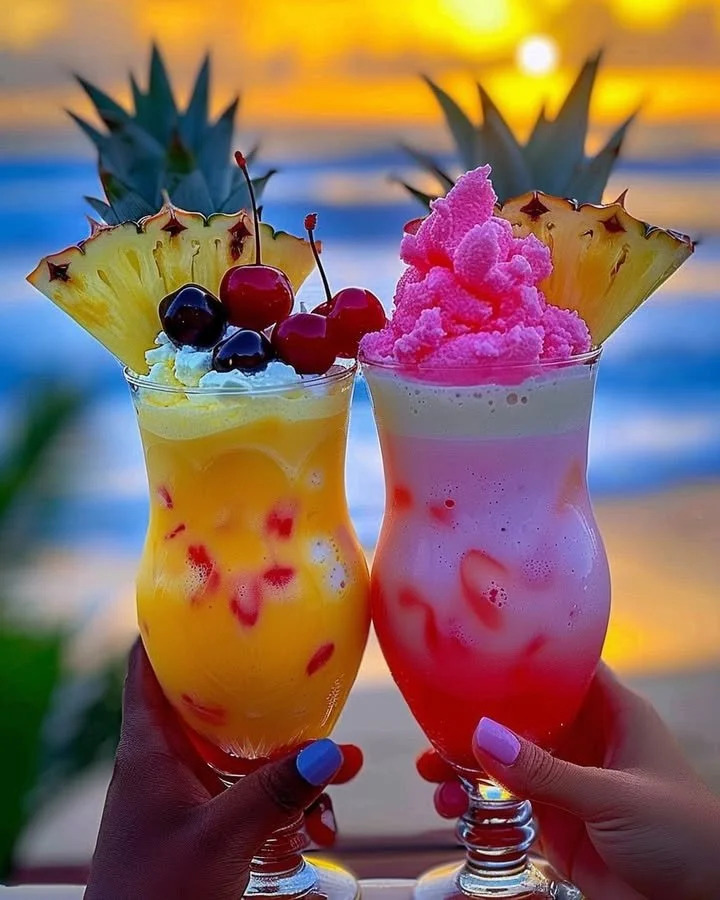Colorful Rainbow Sherbet Piña Colada drink with tropical garnishes