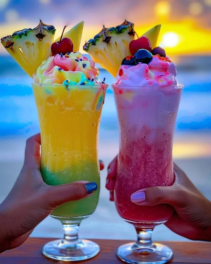 Colorful Rainbow Sherbet Piña Colada in a tropical setting