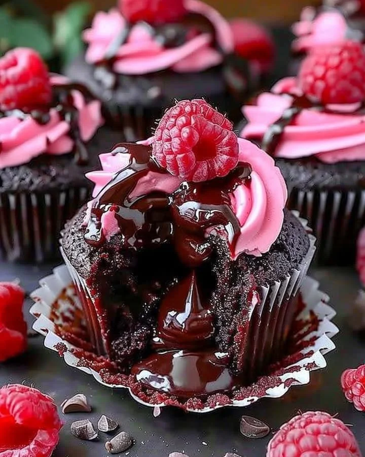 Decadent Raspberry Chocolate Lava Cupcakes with molten center and raspberry drizzle