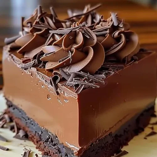 Delicious rich chocolate mousse cake with layers of creamy chocolate frosting.