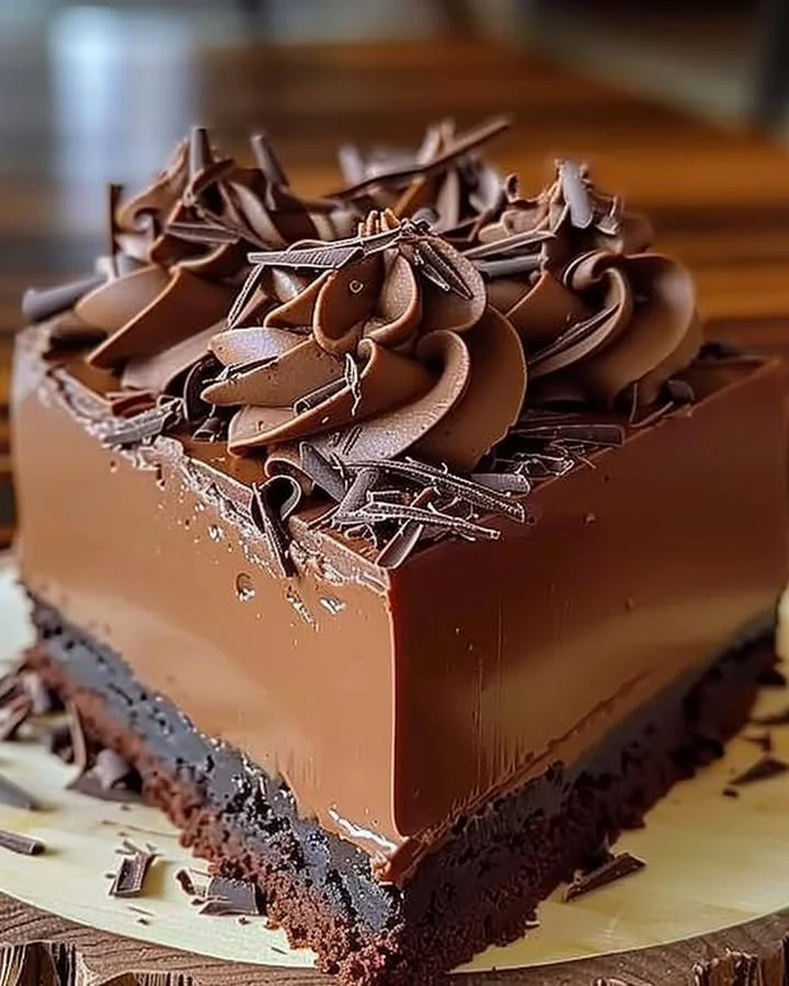 Delicious rich chocolate mousse cake with layers of creamy chocolate frosting.