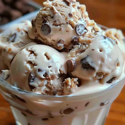 A delicious bowl of Rocky Road Ice Cream topped with marshmallows and nuts.