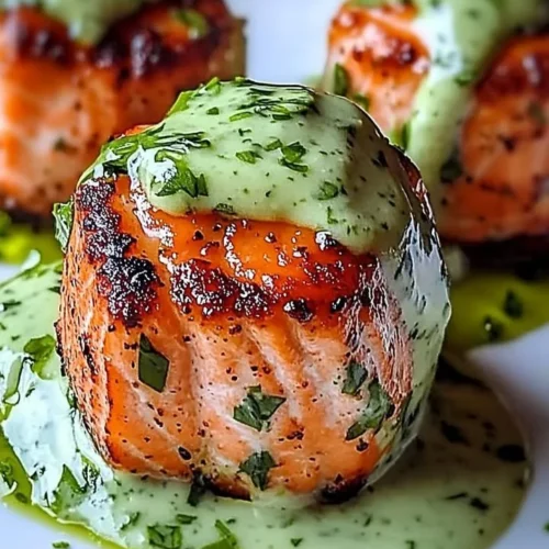 Delicious salmon balls served with creamy avocado sauce