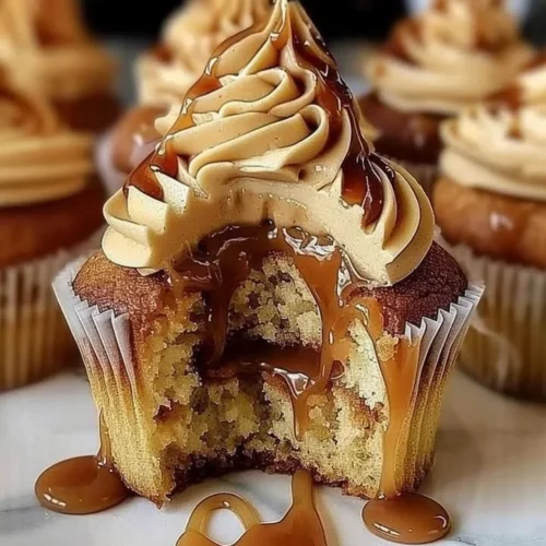 Delicious salted caramel cupcakes topped with creamy frosting and sea salt