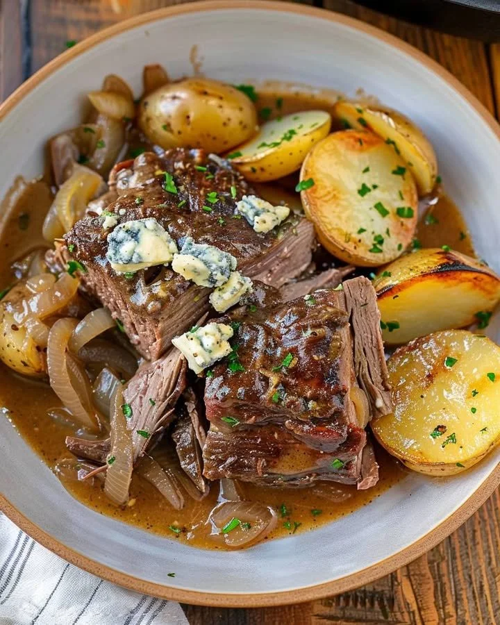 Savory chuck roast served with blue cheese gravy on a plate
