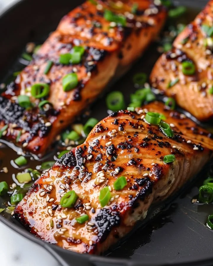 Silken miso-ginger glazed salmon served on a plate with vegetables