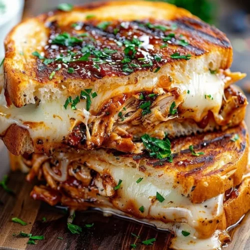Delicious Smoky BBQ Chicken Meltdown piled high with toppings and sauce