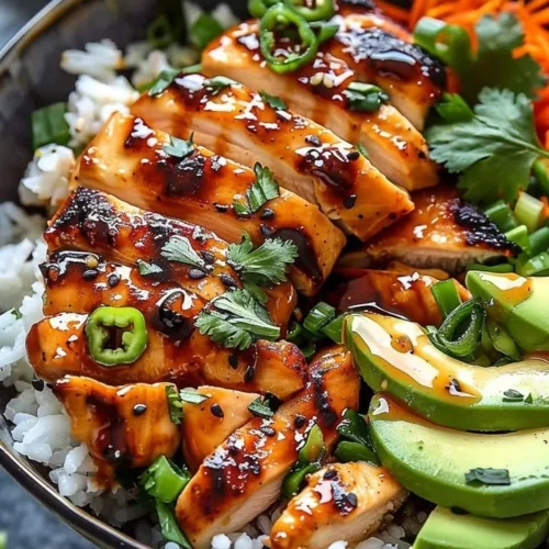 Spicy Honey Ginger Chicken Bowls with vibrant vegetables and aromatic herbs.