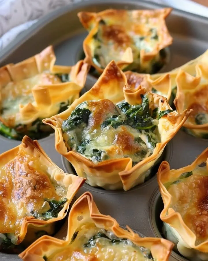 Delicious spinach and artichoke wonton cups served as appetizers.