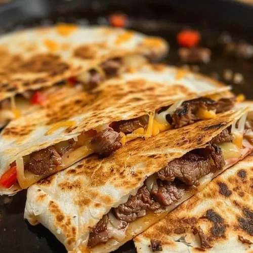 Delicious steak fajita quesadillas filled with beef, peppers, and cheese