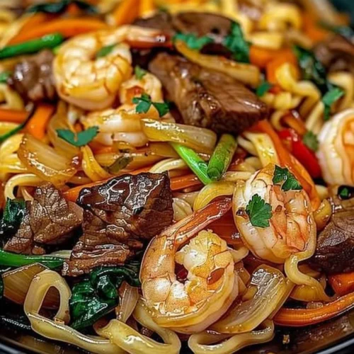 Delicious Steak Shrimp Noodles in a stir-fried dish with vibrant vegetables