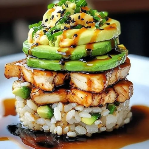 Teriyaki chicken avocado rice stack topped with fresh ingredients
