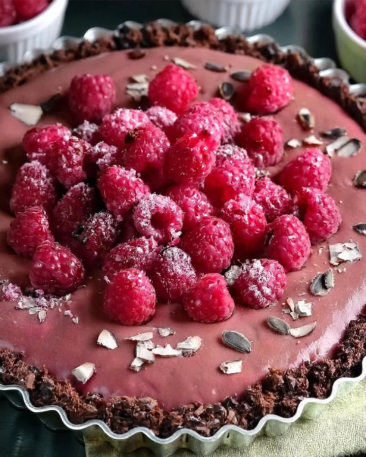 Vegan Raspberry Chocolate Tart with fresh raspberries and chocolate glaze